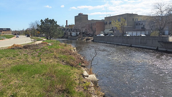 View along the Milwaukee River in West Bend, Wisconsin prior to new riverwalk improvements.