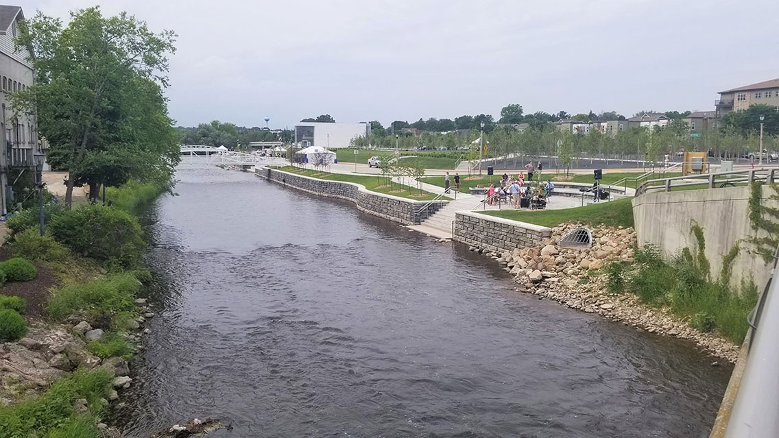 New riverwalk in West Bend, Wisconsin. View of the Milwaukee River, new ADA-compliant walking paths and access to the Museum of Wisconsin Art.