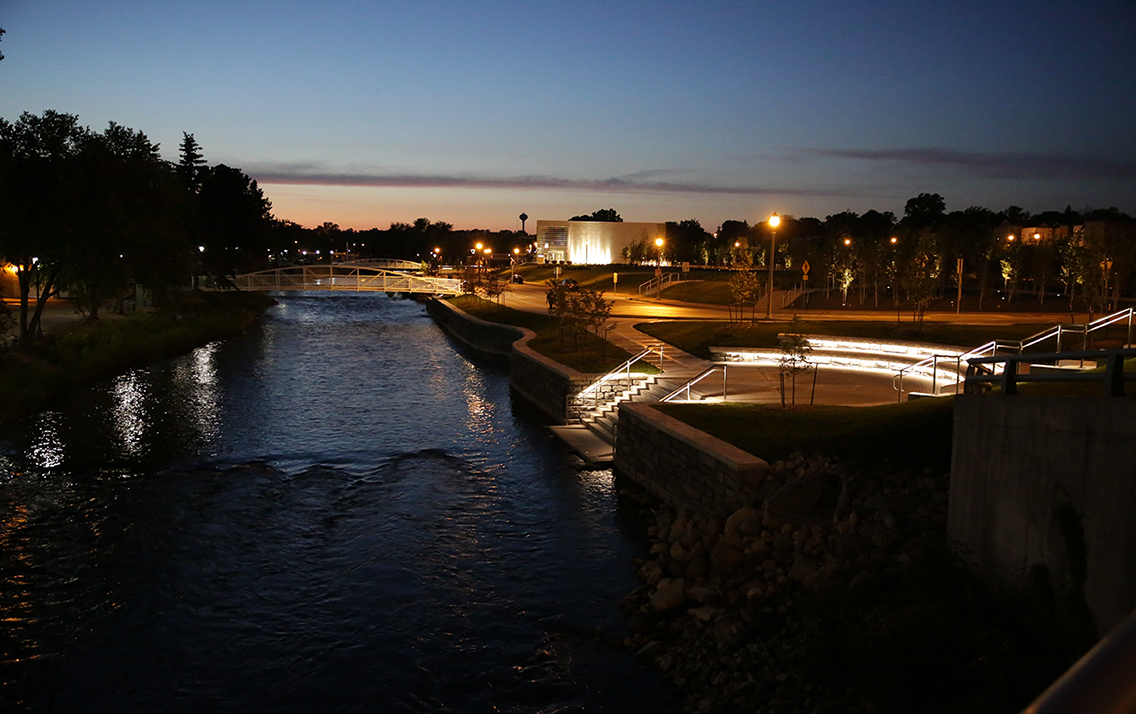 Night shot of new specialty lighting along the Riverwalk in West Bend, Wisconsin after the grand opening celebration.