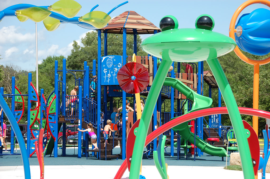 New splash pad and playground at Sauk City Riverfront Park in Sauk City, Wisconsin - design and project by MSA Professional Services. 
