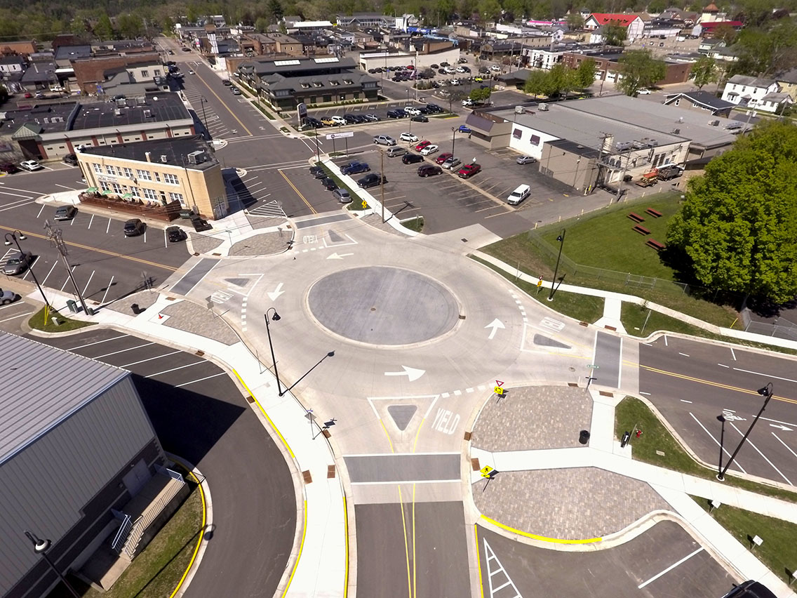 New mini roundabout in Wisconsin Dells solves safety, traffic flow, ADA accessibility and utility issues.