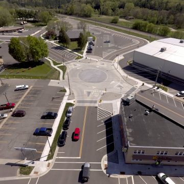 New mini roundabout in Wisconsin Dells solves safety, traffic flow, ADA accessibility and utility issues.