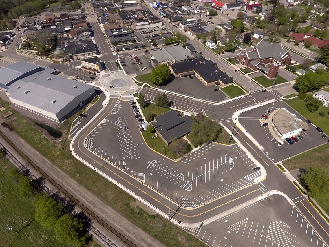 New mini roundabout in Wisconsin Dells solves safety, traffic flow, ADA accessibility and utility issues.