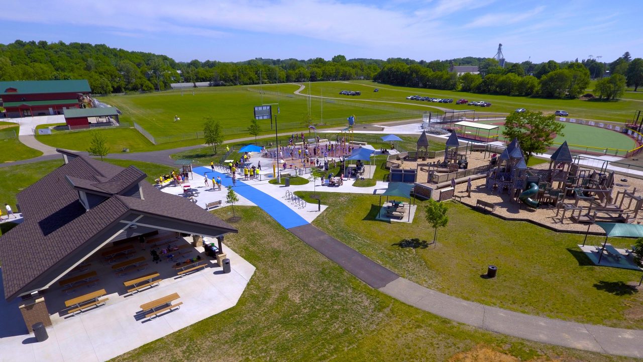 Aerial view of Bakken Park in Cottage Grove, Wisconsin, with new community splash pad, restroom and concessions building, ADA accessibility and connection to Miracle League Field.