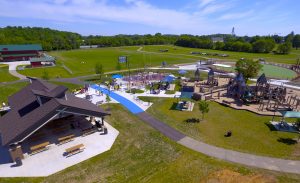 Aerial view of Bakken Park in Cottage Grove, Wisconsin, with new community splash pad, restroom and concessions building, ADA accessibility and connection to Miracle League Field.