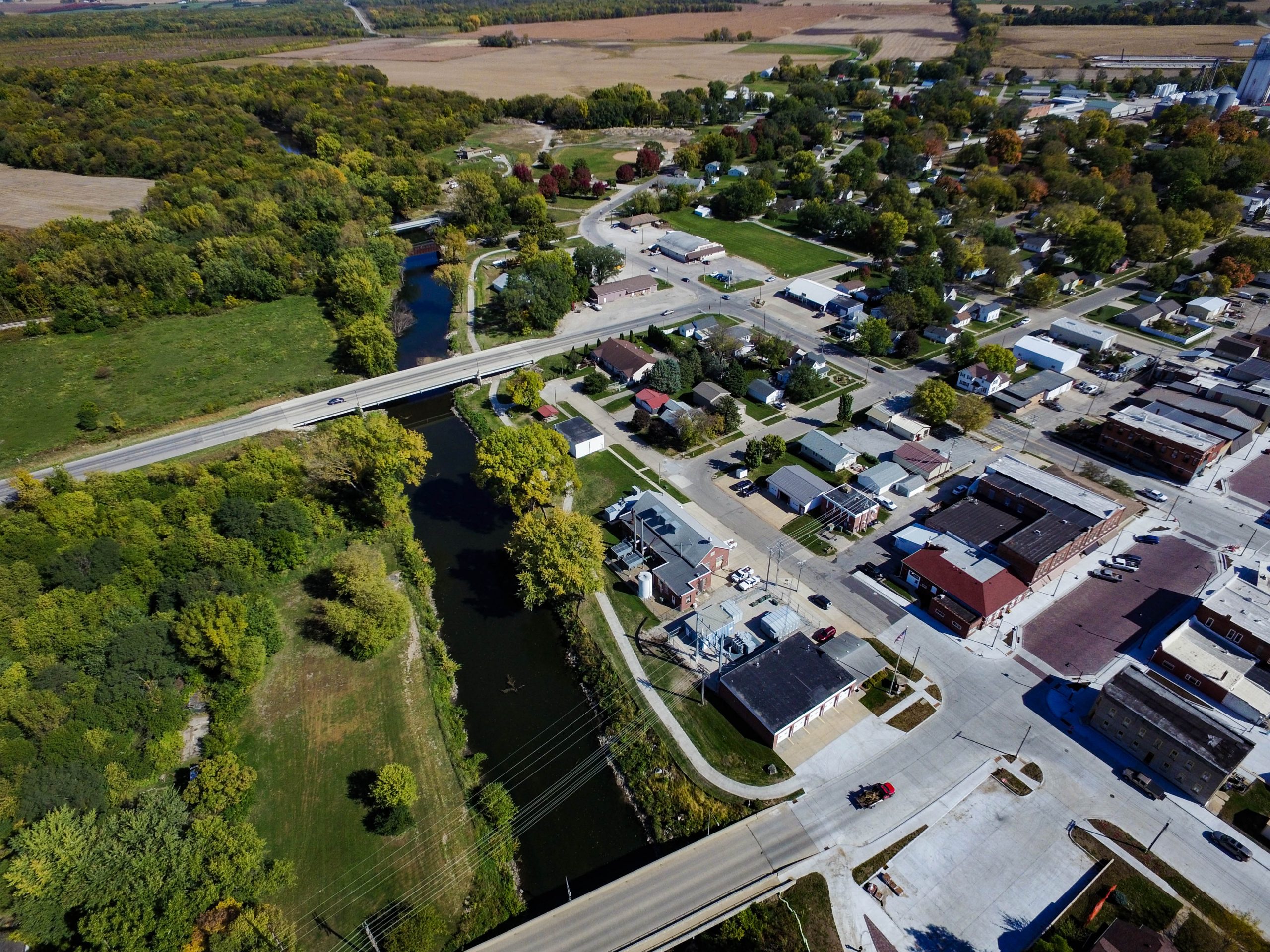 Aerial view of the reconstruction of historic Main Street in La Porte City, Iowa, with brick pavers and updates to neighboring Wolf Creek park. 