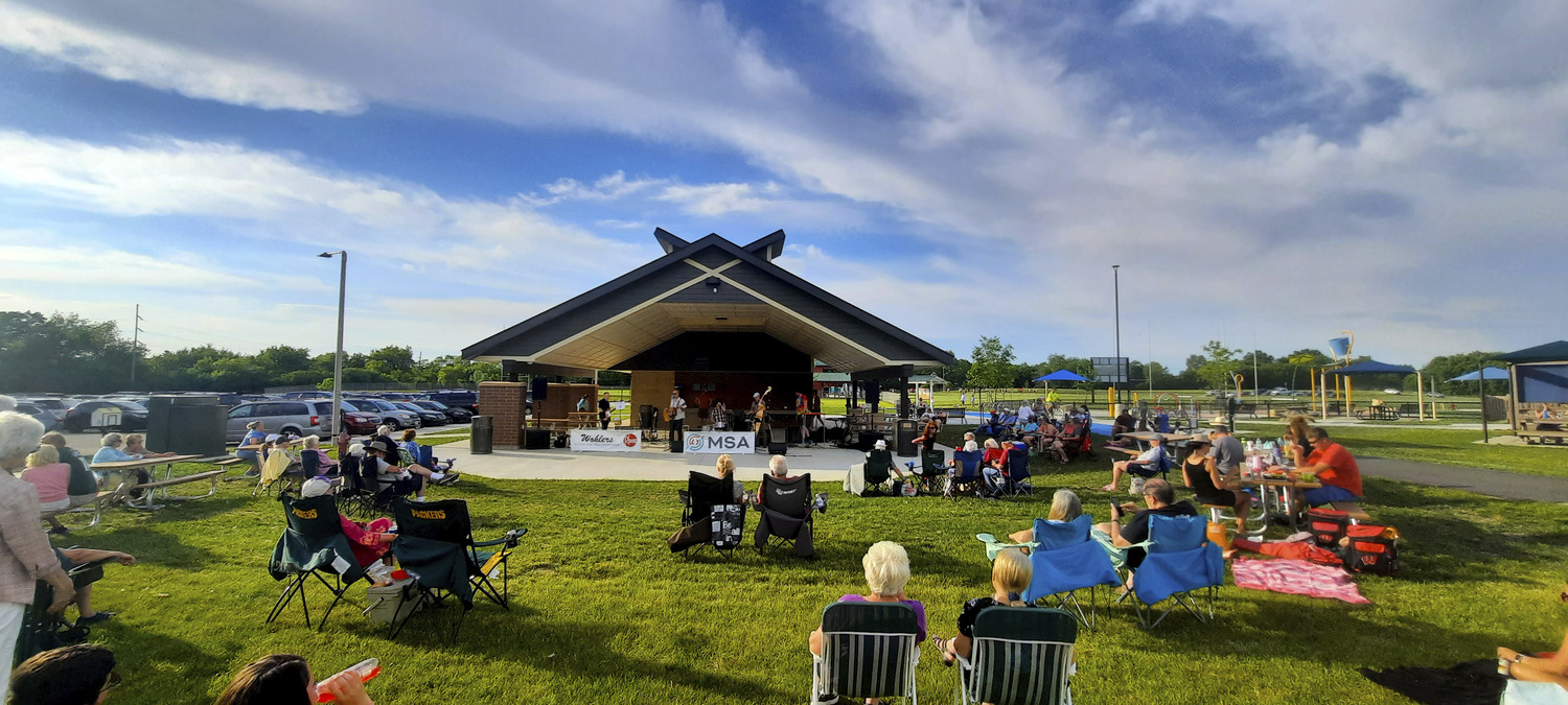 The community of Cottage Grove, Wisconsin, enjoys music in the park at the new ADA compliant restroom and shelter building at Bakken Park.