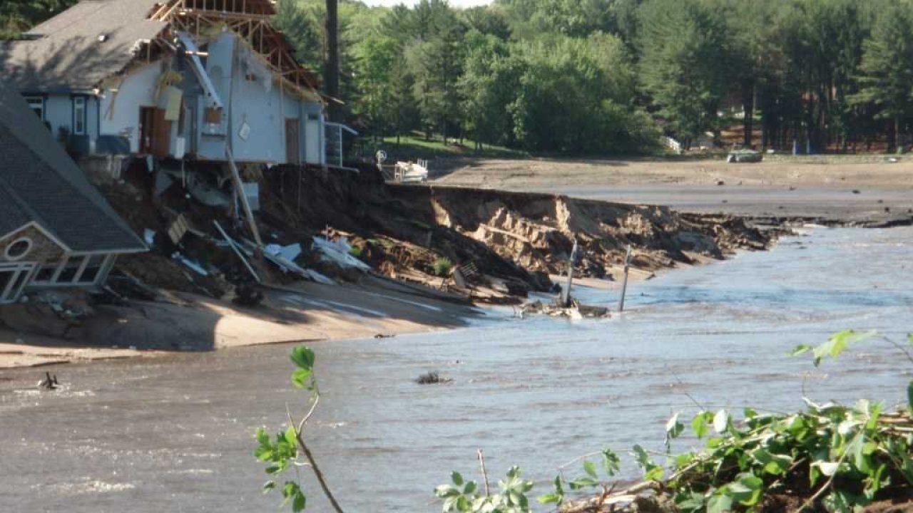 Flooding washes out road and home in Lake Delton, Wisconsin