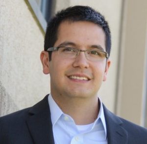 Headshot of MSA wastewater engineer, Matt Castillo, a man in a suit jacket with dark hair and glasses.