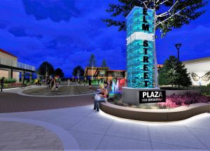 Design rendering at nighttime to show illuminated green and blue ambient columns at the entrance of the new Elm Street Plaza in Wisconsin Dells.