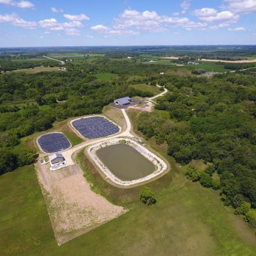 Aerial view of new wastewater treatment facility lagoons with new public works garage in the Village of Palmyra, Wisconsin. Work completed by MSA Professional Services.