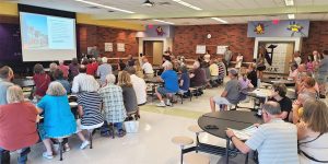 Image of a community planner from MSA Professional Services, sharing information about a new community plan with the public. 