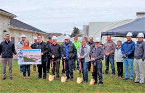 Groundbreaking ceremony with golden shovels for a new wastewater treatment facility in the Village of Stockton, Illinois.