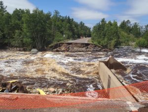 Image of a roadway washed away in high flood waters