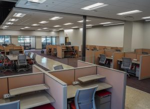 Photograph of the interior of a call center facility at the Visability Center, a workplace center created for people with visual impairments. 