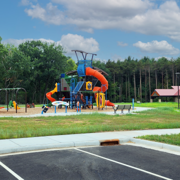 Photo showing a new park pavilion and playground and the Village Forest Park in West Baraboo Wisconsin