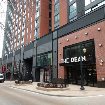 The Dean in Champaign Illinois is a mixed-use development of modern student apartments and first-floor retail.
