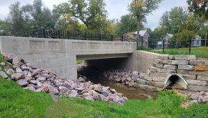 View of new bridge in the Village of Westfield, Wisconsin, but cut-stone stacked wall for shoreline protection.