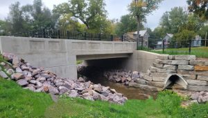 Side-by-side before and after images of the 94-year-old bridge in the Village of Westfield, Wisconsin, and it's new safer replacement structure. 