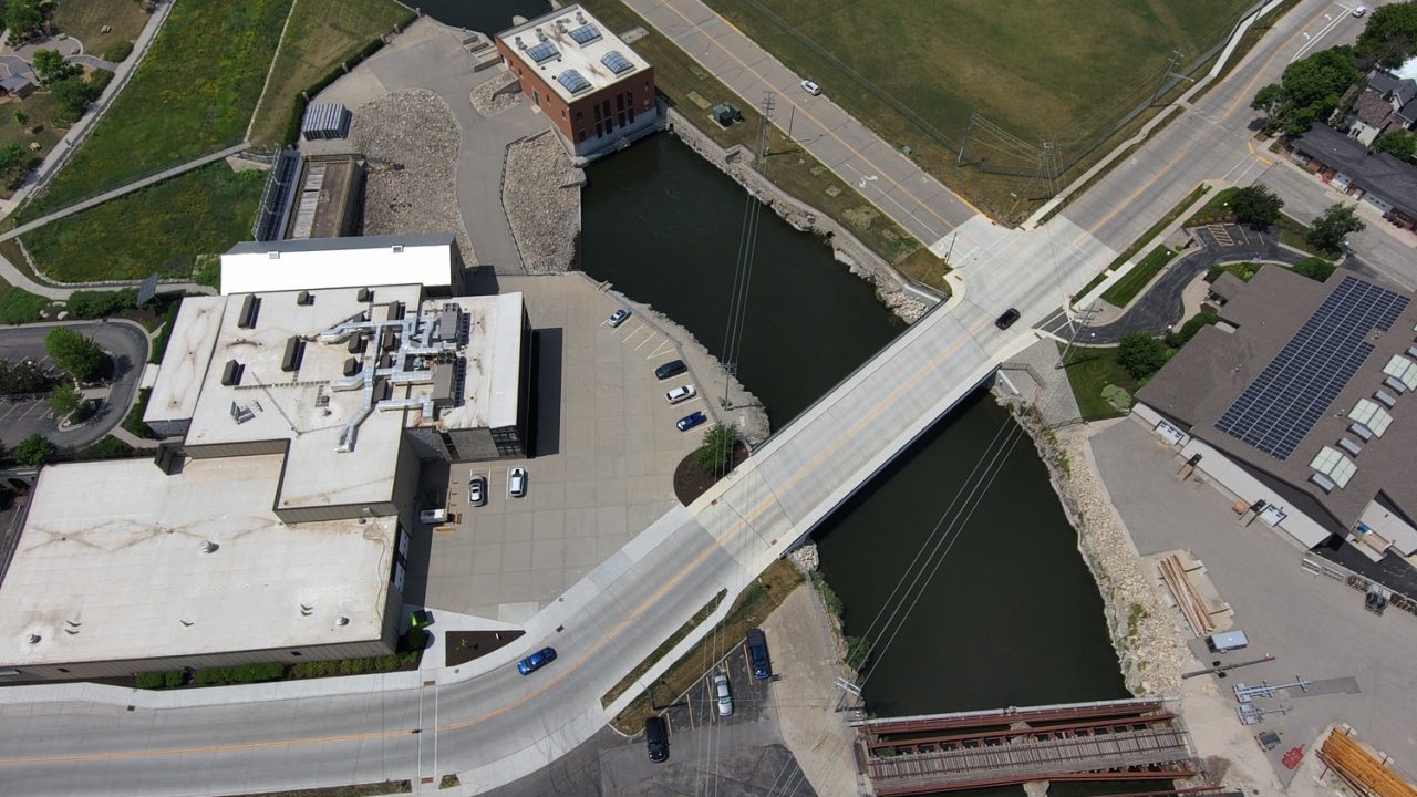 Aerial view of a new bridge in the City of Kaukauna, Wisconsin, adjacent to the community's hydro utility and historic district.