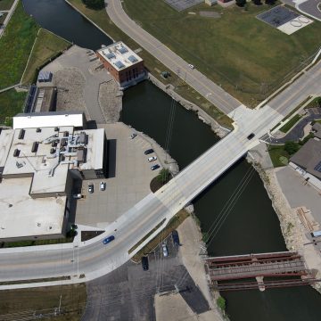 Aerial view of a new bridge in the City of Kaukauna, Wisconsin, adjacent to the community's hydro utility and historic district.