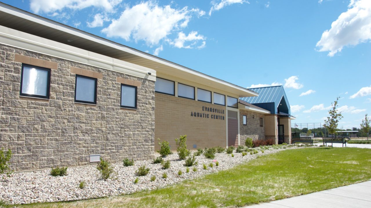 Photo of the exterior of a new aquatic center facility in the city of evansville, wisconsin